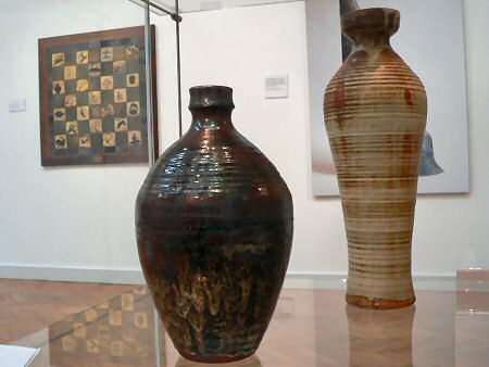 William Staite-Murray pots with Bernard Leach tiled plaque beyond
