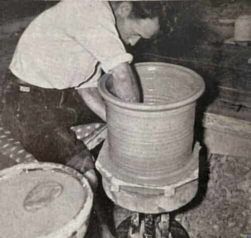 Workman throwing a large bowl