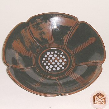 Tenmoku glazed porcelain dish in the form of a flower head.