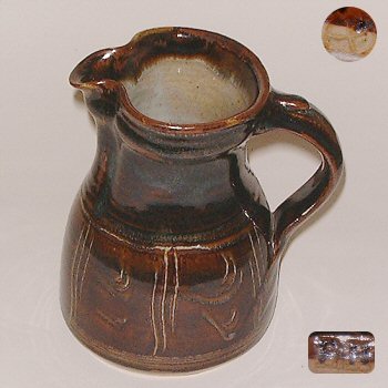 Iron glazed jug with combed decoration