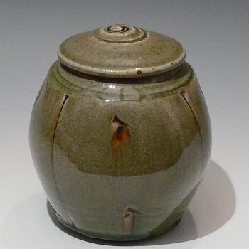 Squared stoneware caddy with incised decoration and celadon ash glaze.