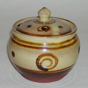 Earthenware marmalade jar with slip trailed decoration.