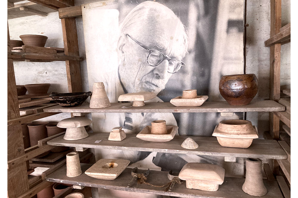 Bernard Leach looking over some old moulds